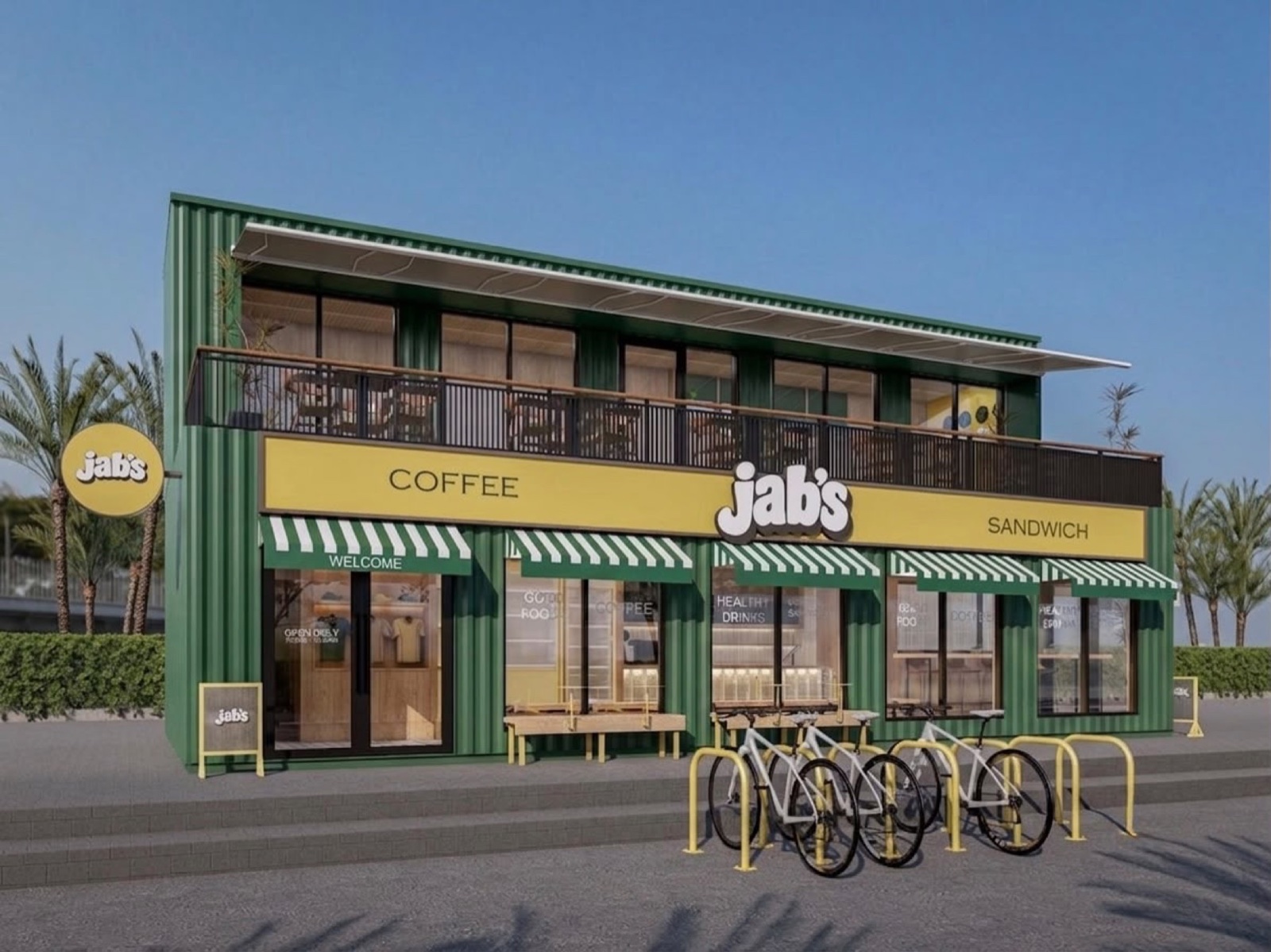 The Jab's facade: a green container building with a yellow sign, striped awnings and a rooftop terrace.
